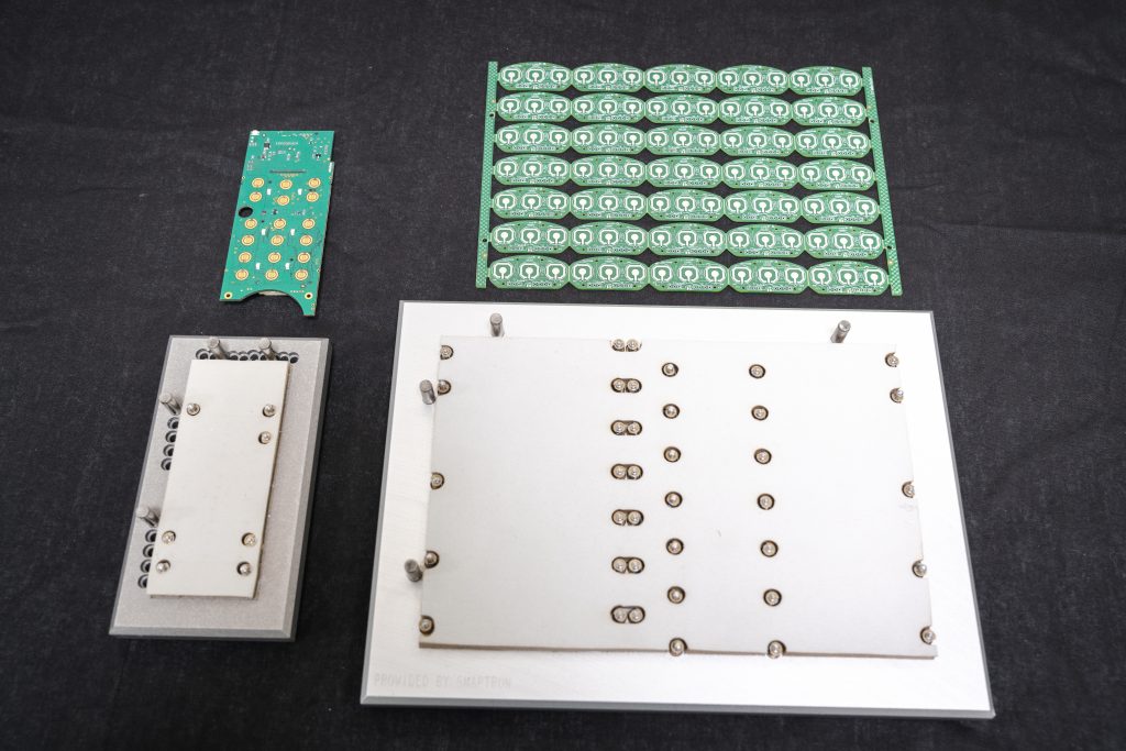 placement fixture for securing domes to the circuit board