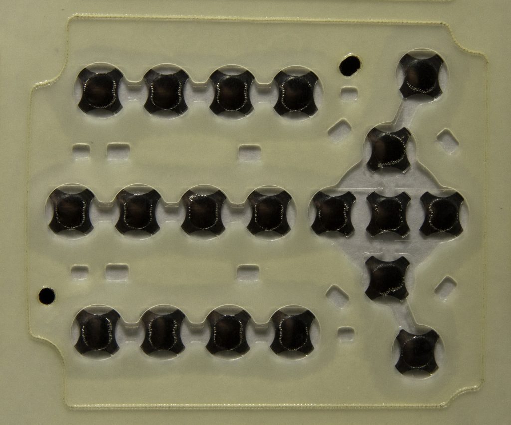 Spacer layer with metal domes